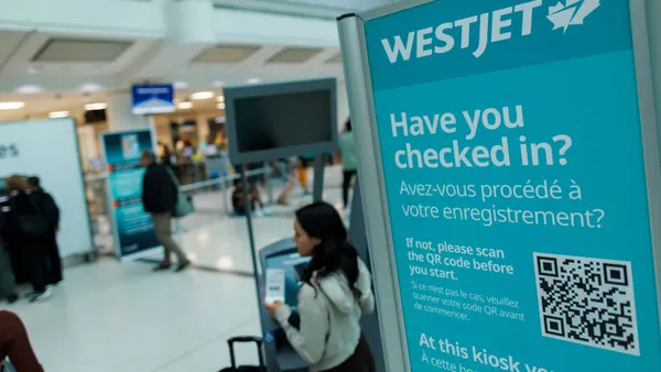 Westjet signage is seen at the Toronto Pearson International airport on June 30, 2024 in Toronto, Canada. The airline said some customer data was stolen during a June 2025 cyberattack.