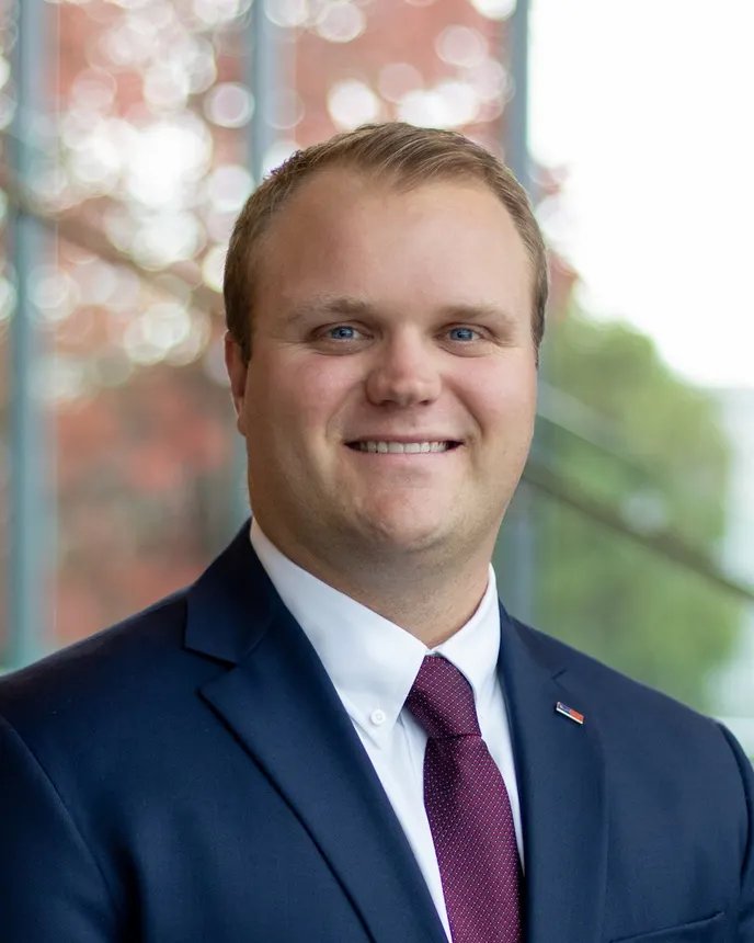 A headshot of Doug Harrison