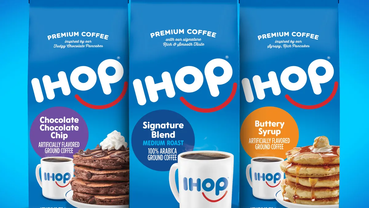 Three bags of IHOP-branded coffee in Chocolate Chocolate Chip, Signature Blend and Buttery Syrup flavors, against a blue background.