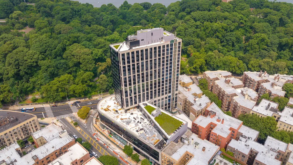 An aerial view of a building with construction nearly finished.