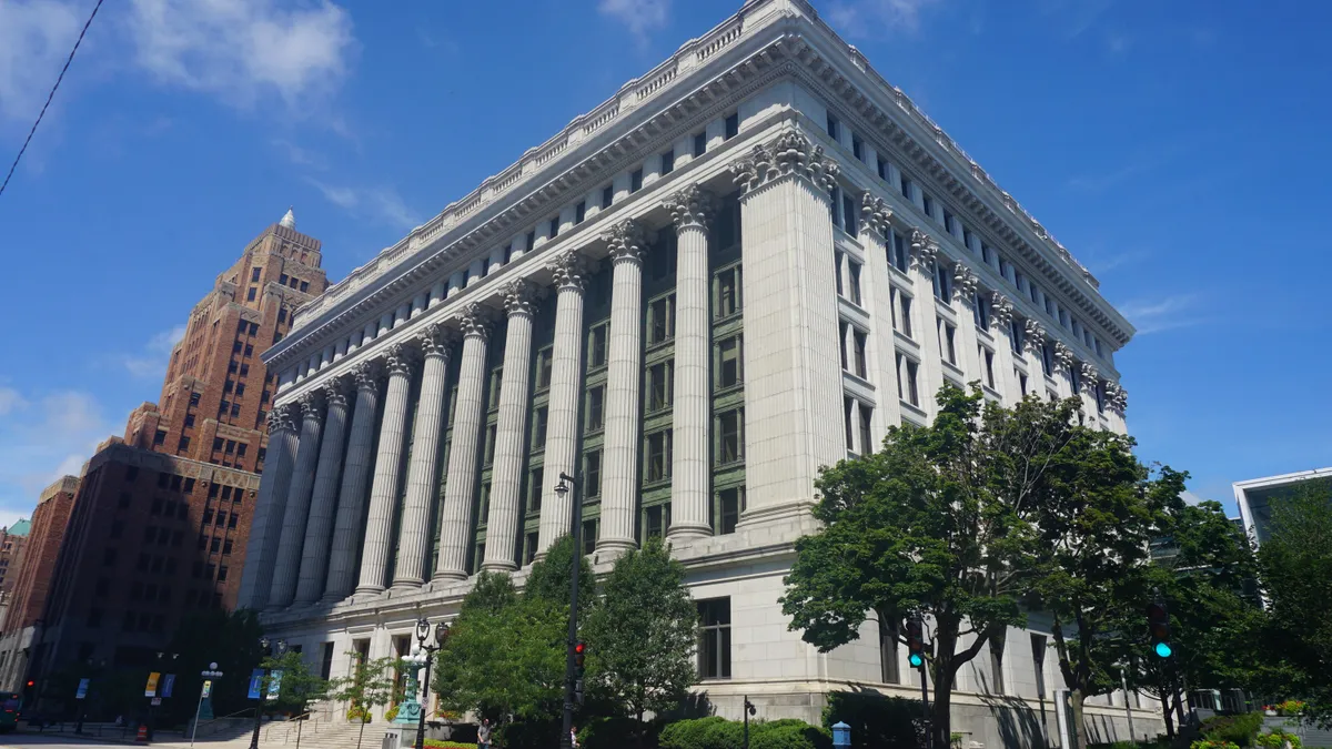 an exterior view of the Northwestern Mutual headquarters building as seen from the street on a sunny day