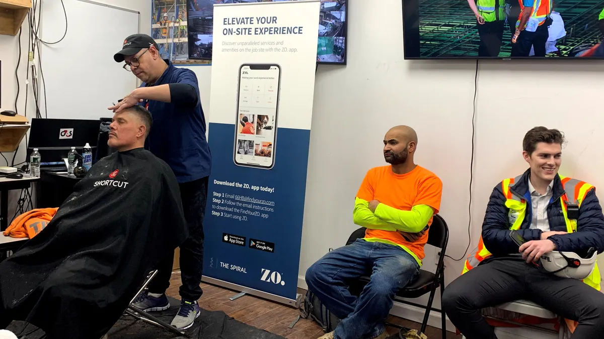 Workers receiving free haircuts at The Spiral project in New York City's Hudson Yards