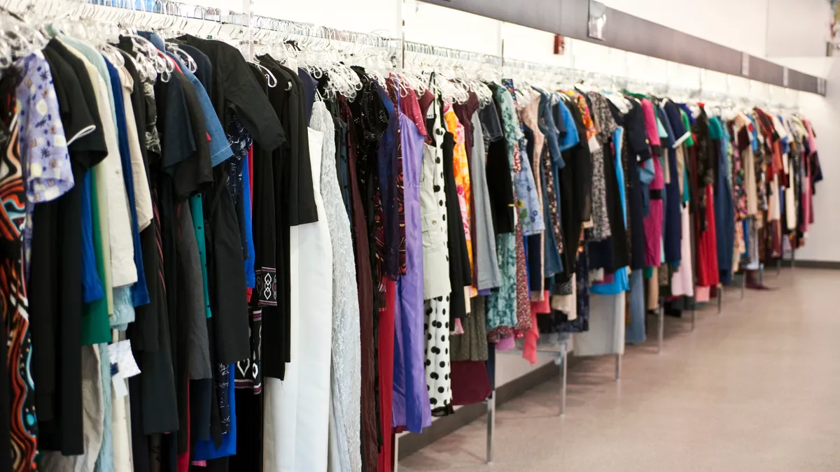 A rack of clothes at a Goodwill store.