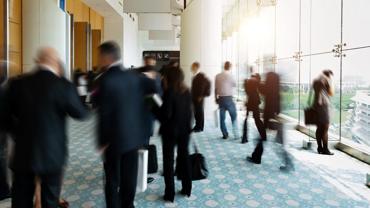 business executives mingling in a conference building