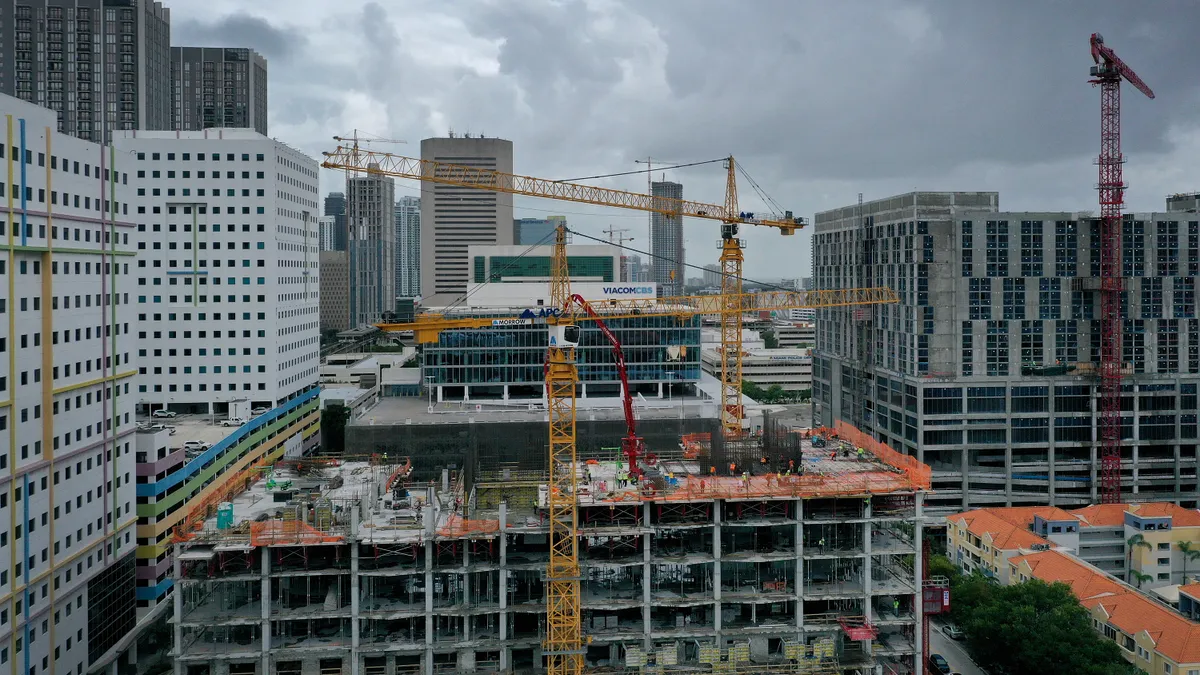 In an aerial view, construction cranes dot the skyline on October 02, 2023 in Miami, Florida