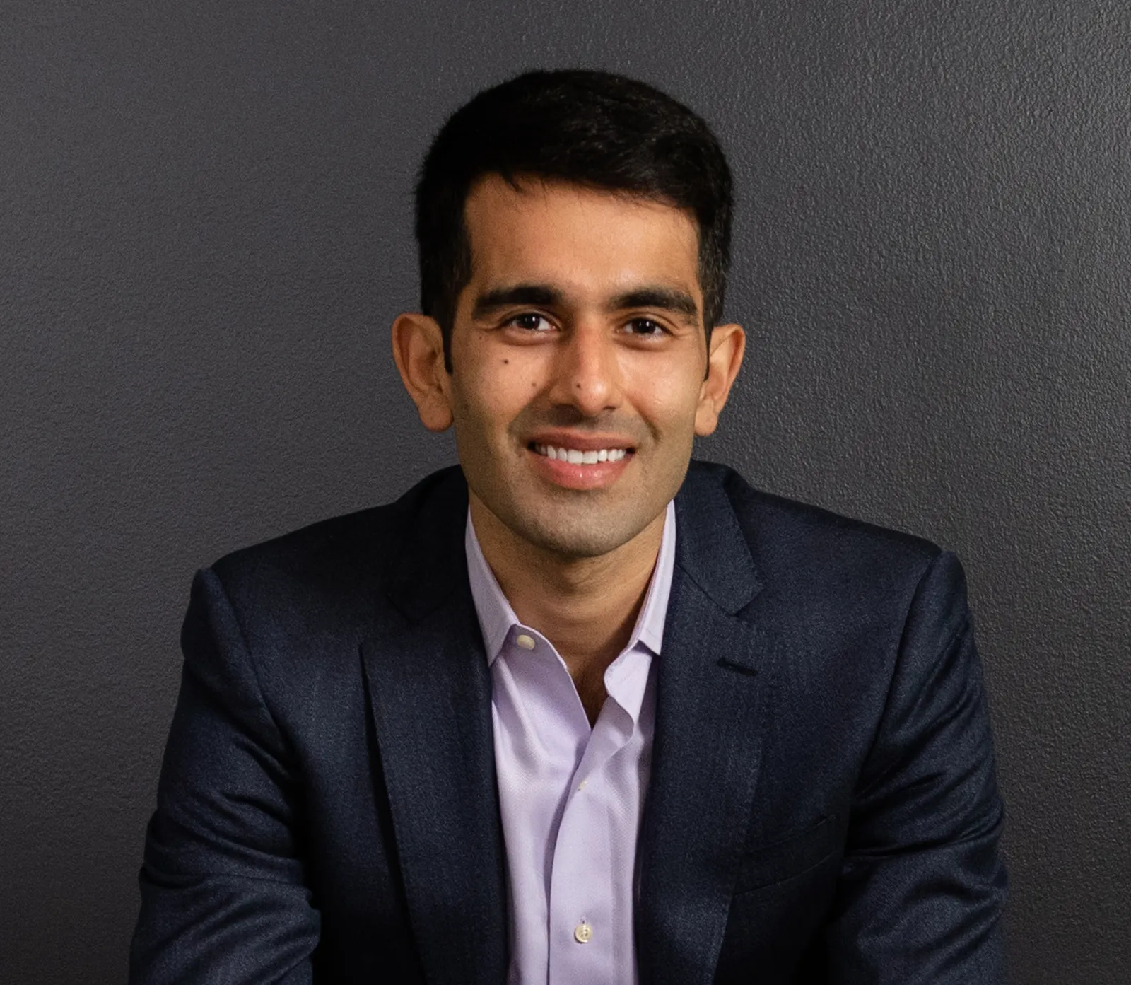 A headshot of Arvin Vohra, CEO of Redaptive