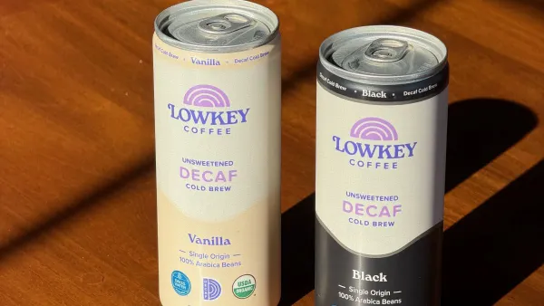 Two cans of Lowkey Coffee are on a table.