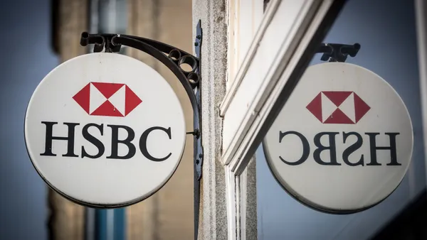 The HSBC logo is seen outside a bank branch.