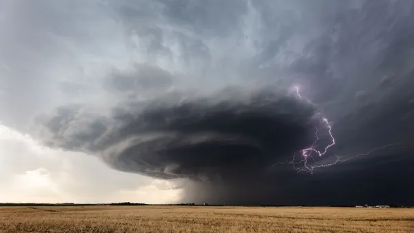 Ominous storm clouds and lightning appears in the sky.