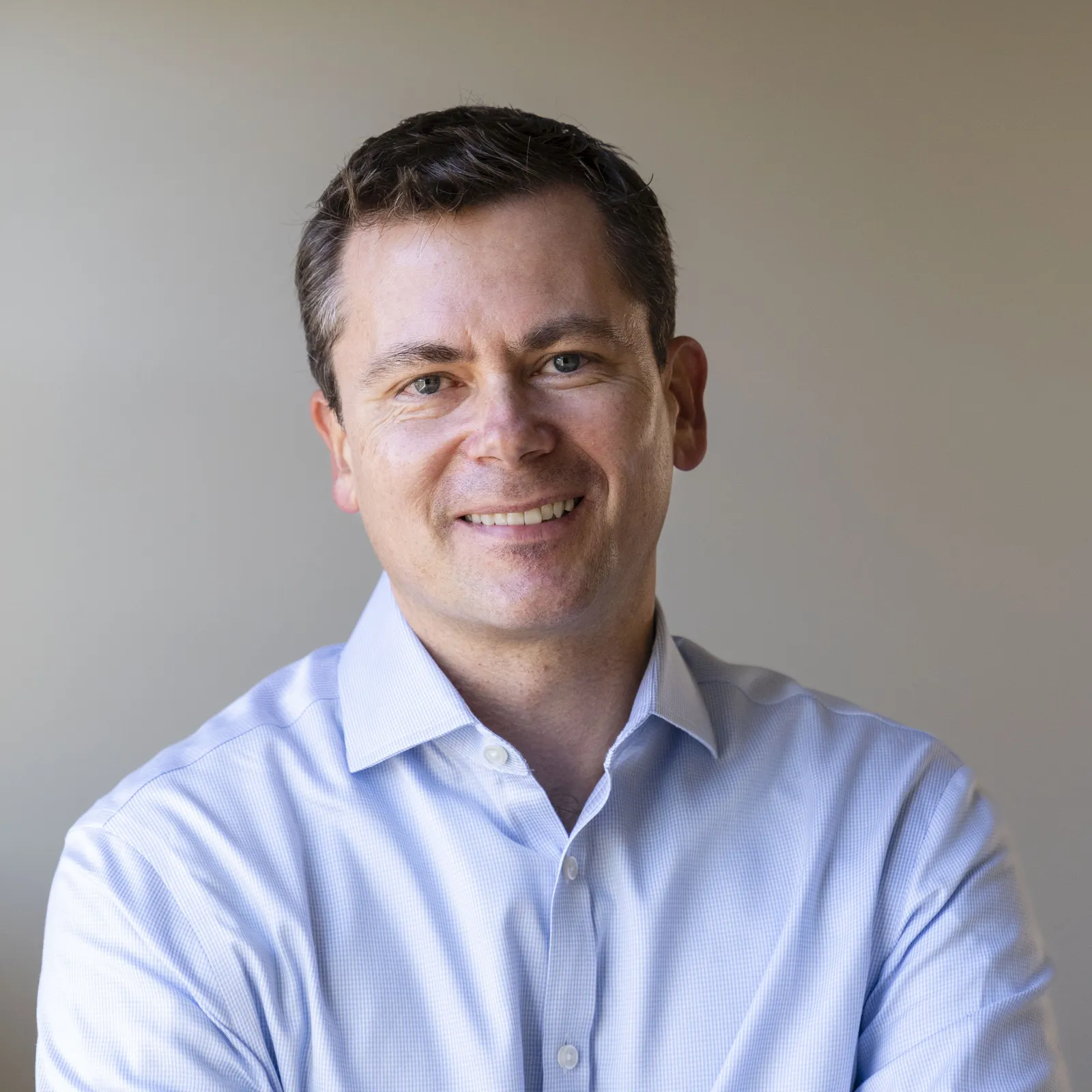 Headshot of man in button-down shirt