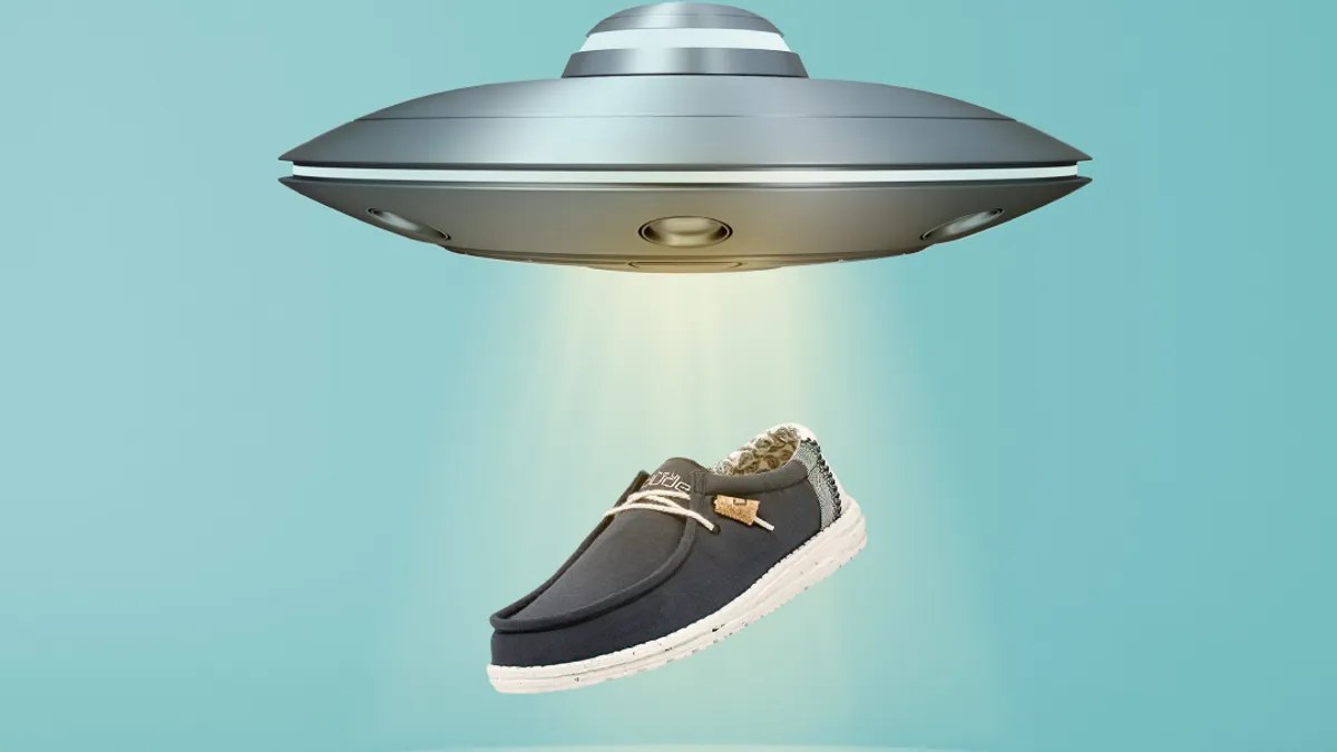 Flying saucer is beaming up a Heydude shoe.