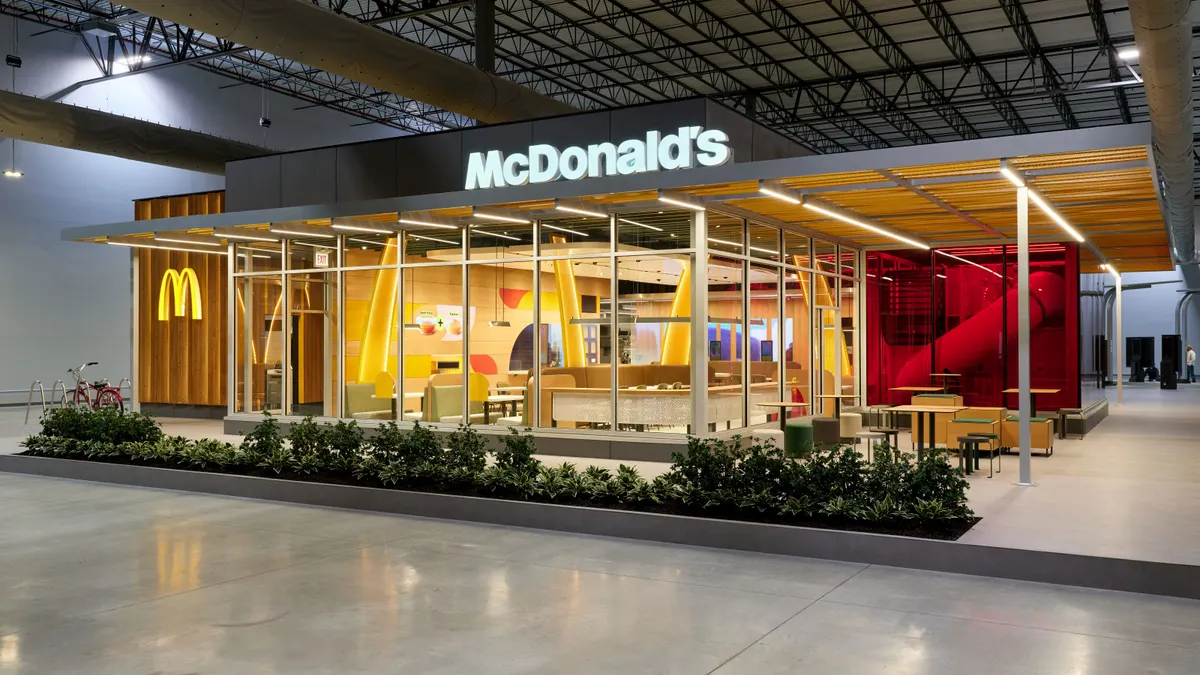 A photograph of an empty McDonald's restaurant within a warehouse