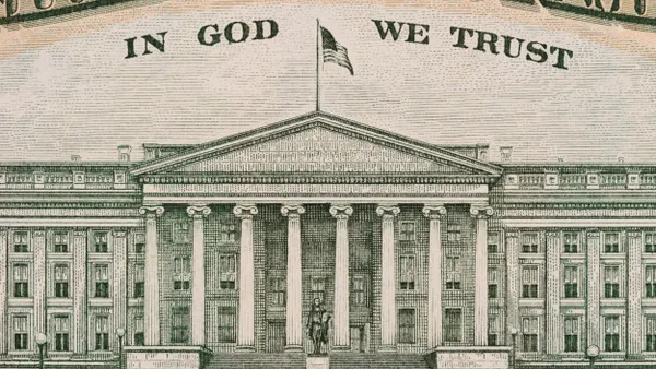 A close-up image of the U.S. Treasury building as printed on the back of a U.S. ten-dollar bill. It features detailed architectural elements including columns, windows, a statue in front, and the phrase “In God We Trust” above.