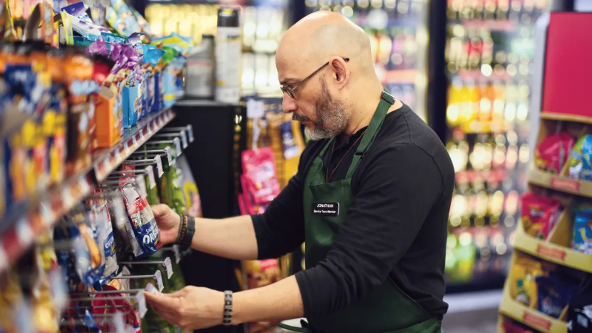 Man restocking a C-store shelf