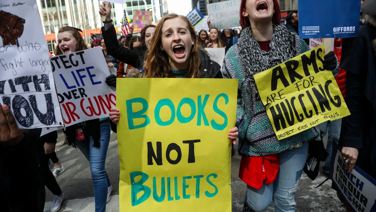 Protestors shout as they march down Sixth Avenue during the March For Our Lives, March 24, 2018 in New York City.