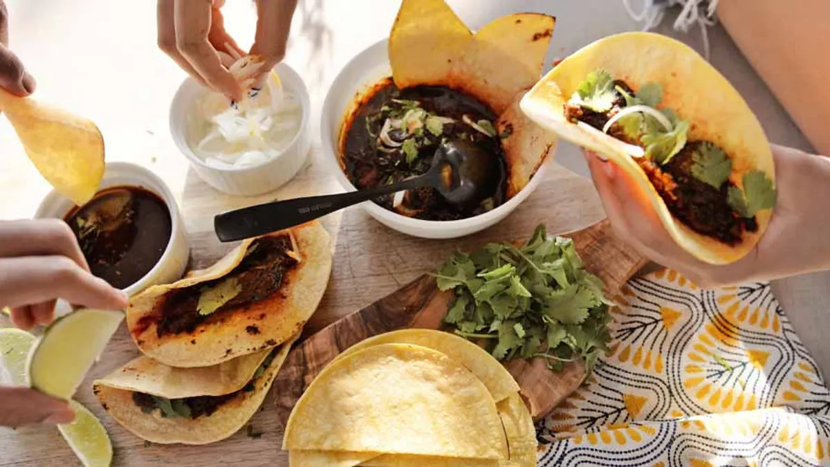 Group of people making their own tacos