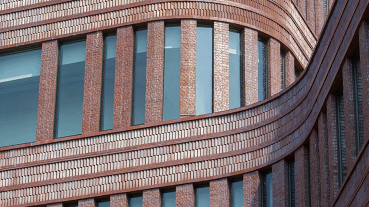 Close up of a curved brick building