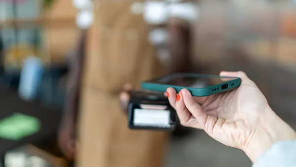 Apple Pay payment card issuers transaction fees mobile devices