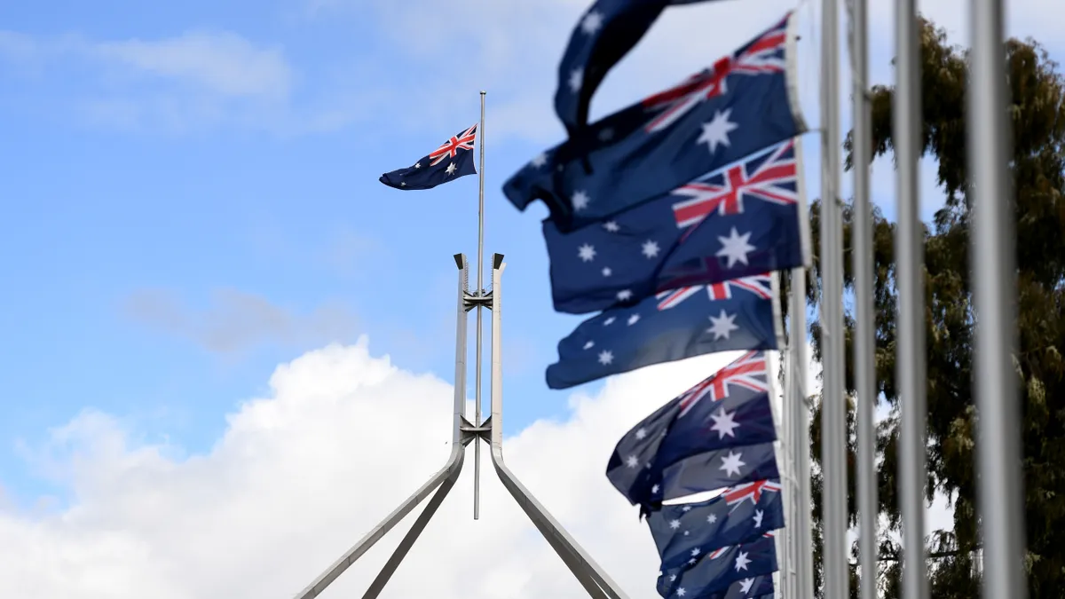 Australian flags fly.