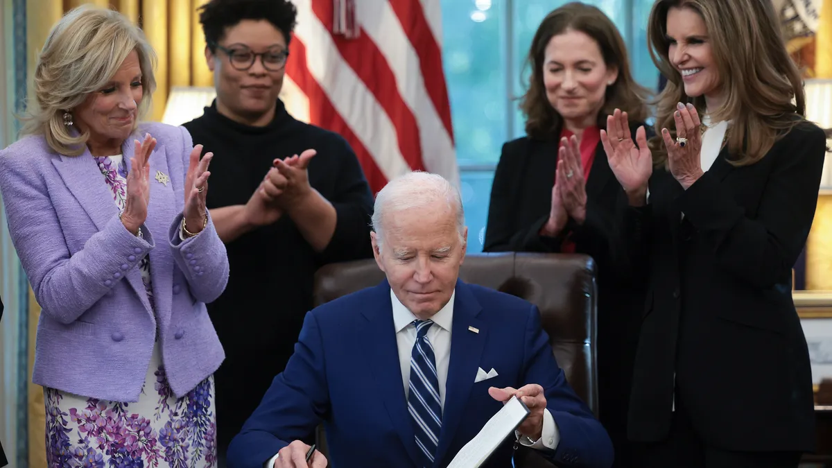 President Joe Biden signs a presidential memorandum that will establish the first-ever White House Initiative on Women’s Health Research.