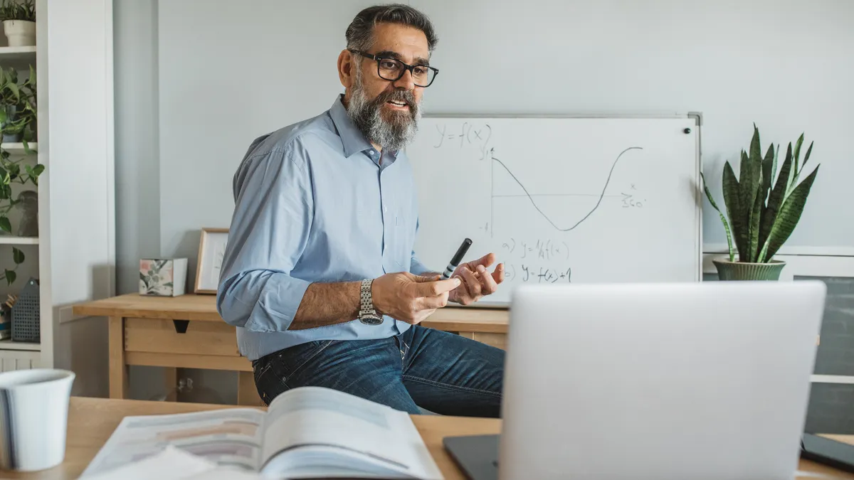 Professor teaching students remotely