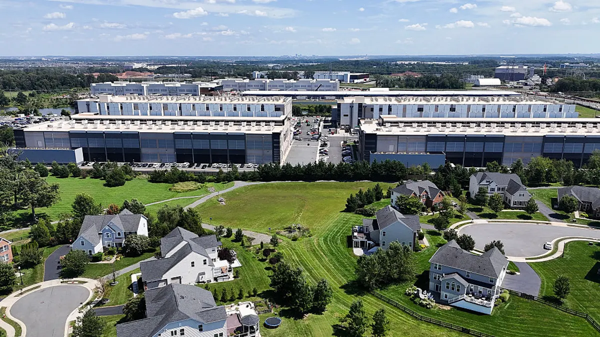 Homes sit near data center buildings.