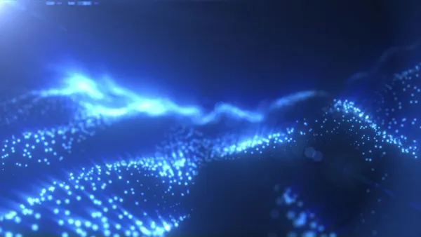 Blue glowing particle waves forming a futuristic abstract landscape with soft depth and digital texture