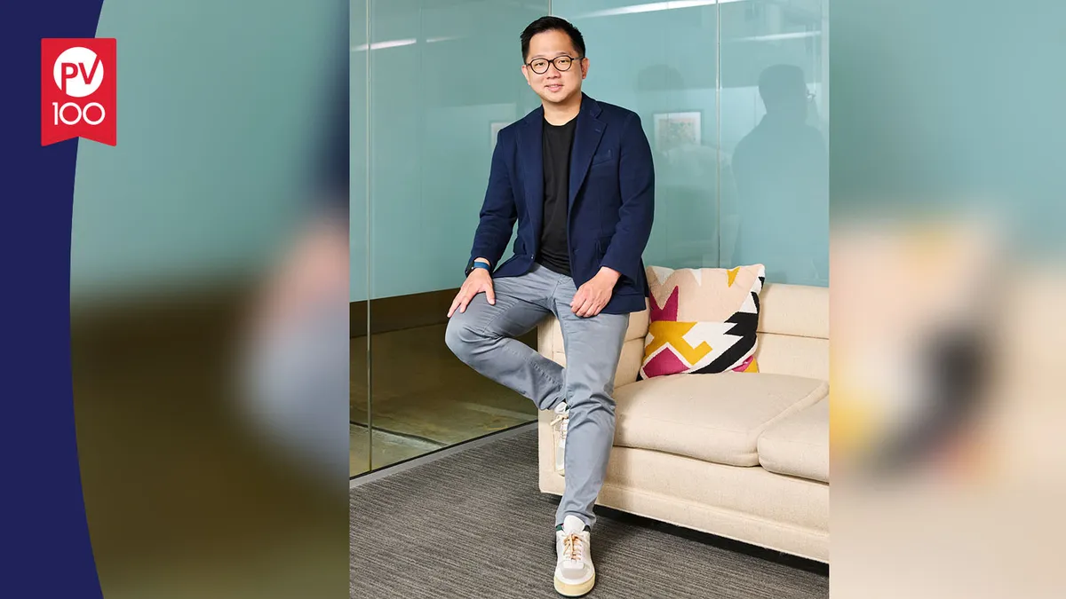 A portrait of Dr. Jonathan Ng framed with a banner icon that reads "PV 100"