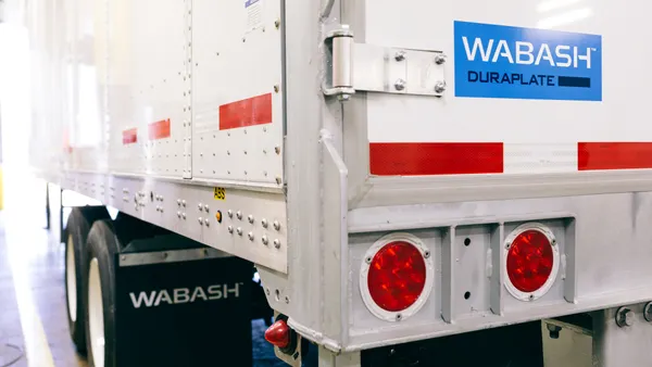 A freight truck with the blue Wabash logo on the lower left corner.