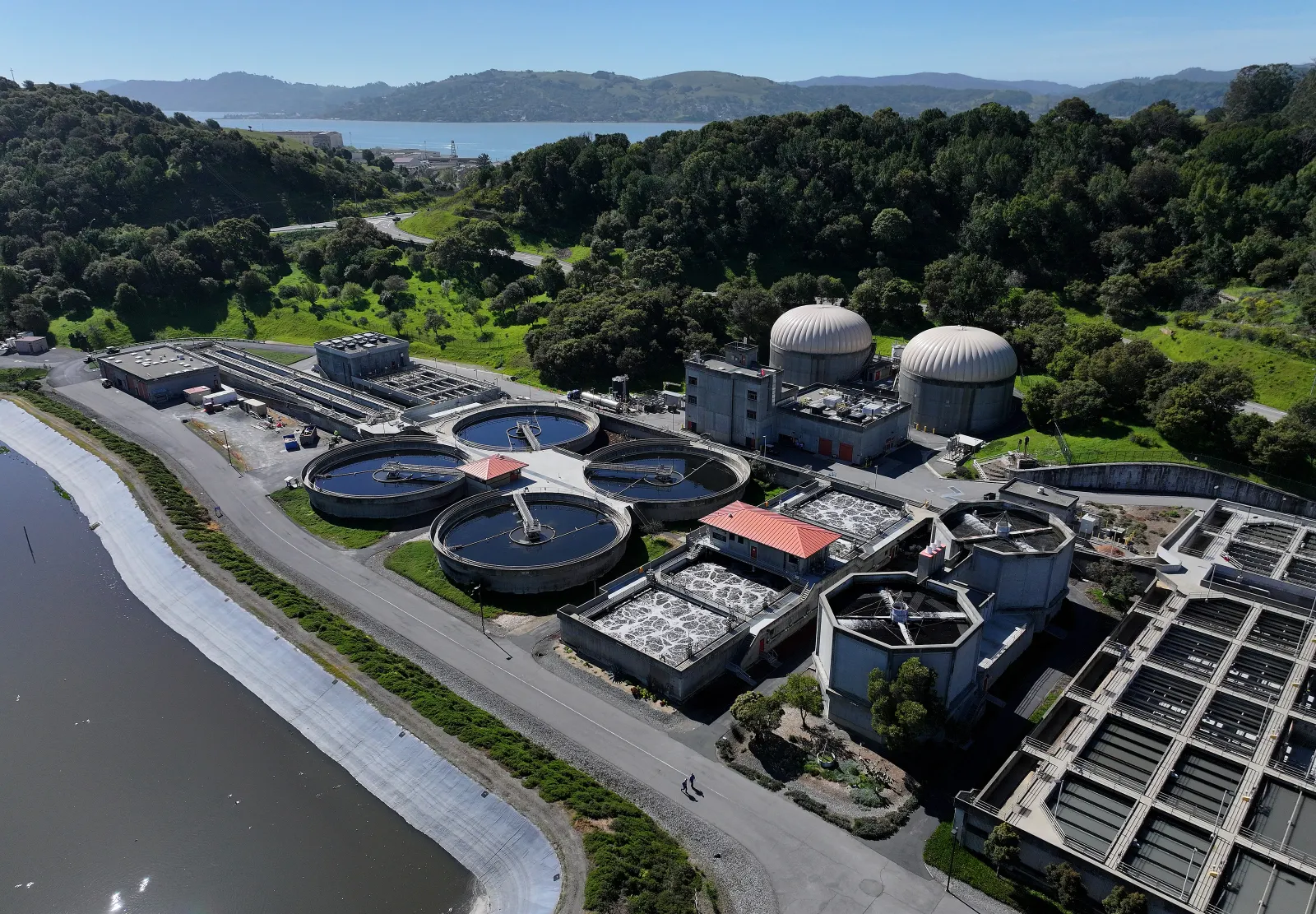 Pools of water are seen in an aerial photo of a wastewater treatment plant