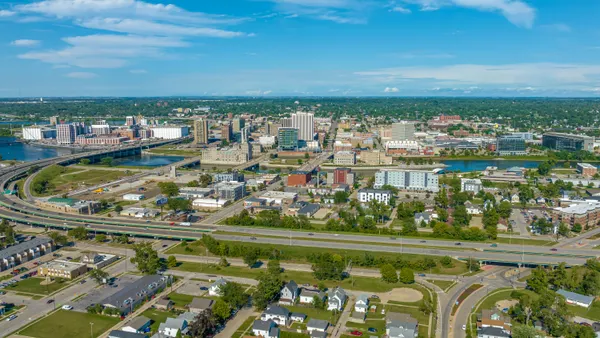 An aerial view of a downtown landscape on a sunny day.