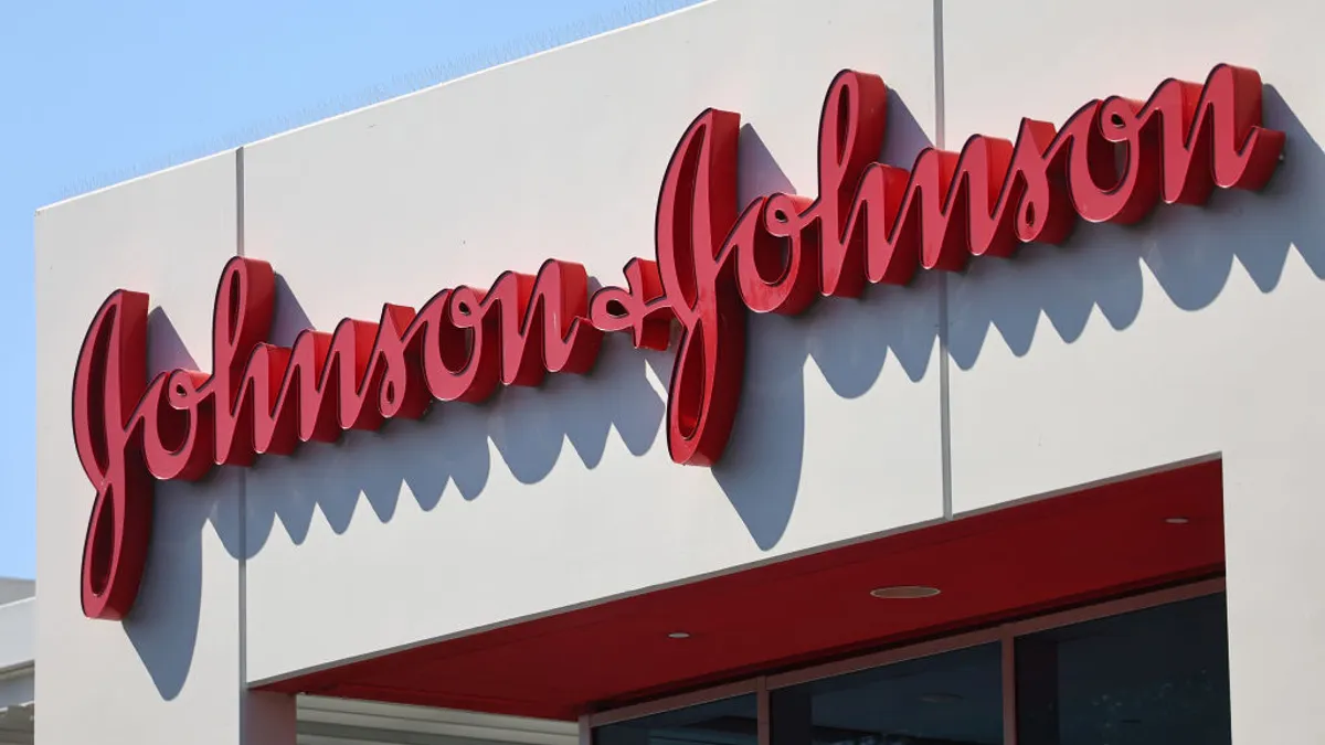 An exterior shot of the johnson and johnson logo in red outside the company's headquarters