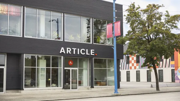 A gray storefront with the word "Article" on the front.