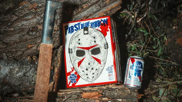 A knife next to a can of Pabst Blue Ribbon beer and a PBR box featuring a Jason Voorhees cut-out mask.