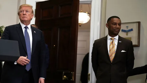 President Donald Trump meets with Johnny C. Taylor Jr. of the Society for Human Resource Management in the White House