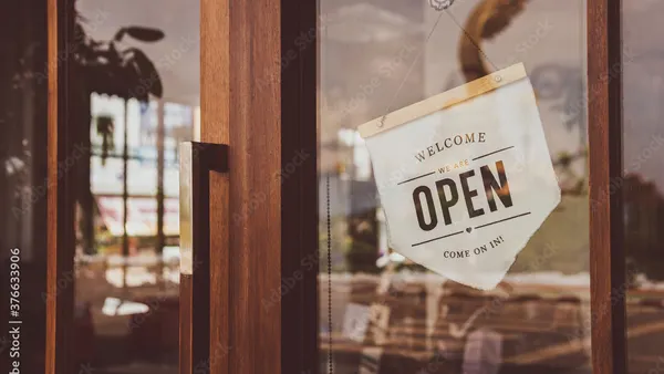 Welcome open sign in local café