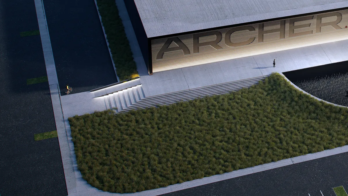 A rendering of the Archer Aviation facility in Georgia, with green bushes, a gray side walk and stairs, and the words ARCHER in capital letters on the building.