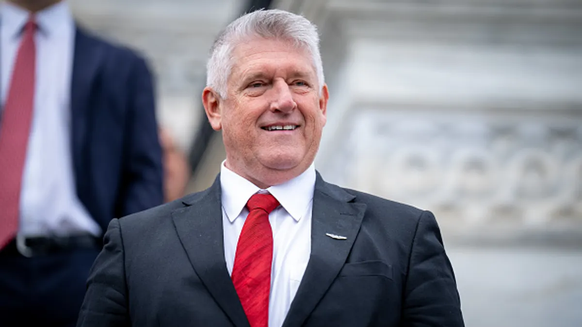Rep.-elect Troy Downing smiles for a group photo