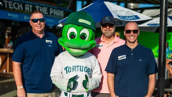 three men and a turtle mascot