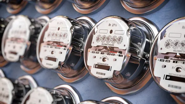 Electric meters in a row measuring power use. Electricity consumption concept. 3d illustration