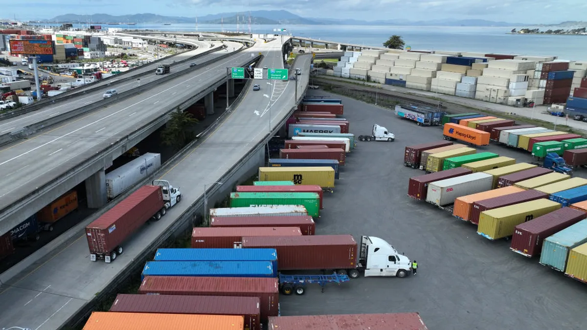 In an aerial view, A truck moves along a freeway on March 31, 2023, in Oakland, California.