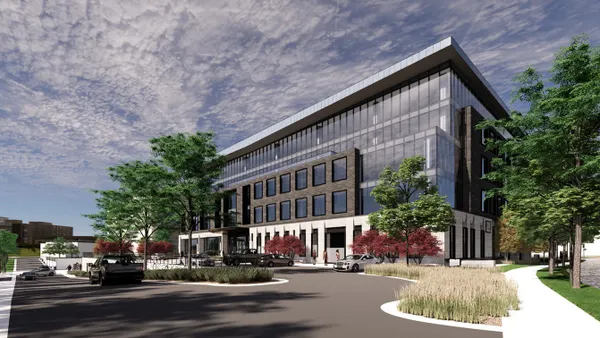 A rendering of a large building that takes up much of the picture and is gray.