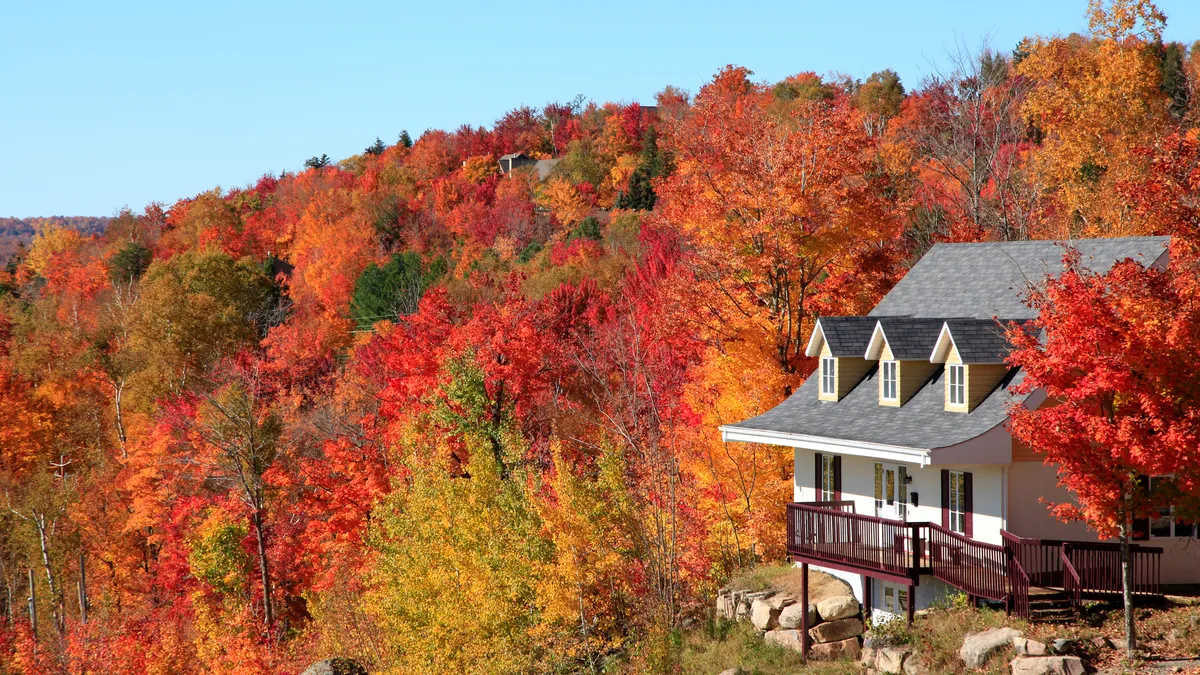 A cabin at the top of a mountain with a nice view