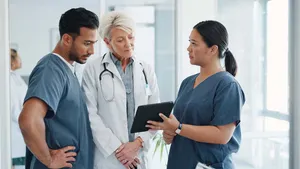 Doctor, team and tablet in discussion with senior for healthcare training, advise or support at hospital.