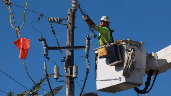 A lineman repairs power lines after Hurricane Milton passed through the area on October 12, 2024, in Englewood, Florida.