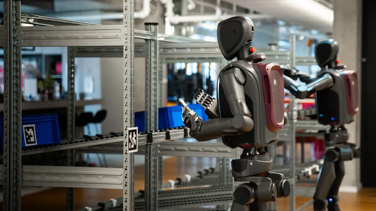 Humanoid robots work on a production line.