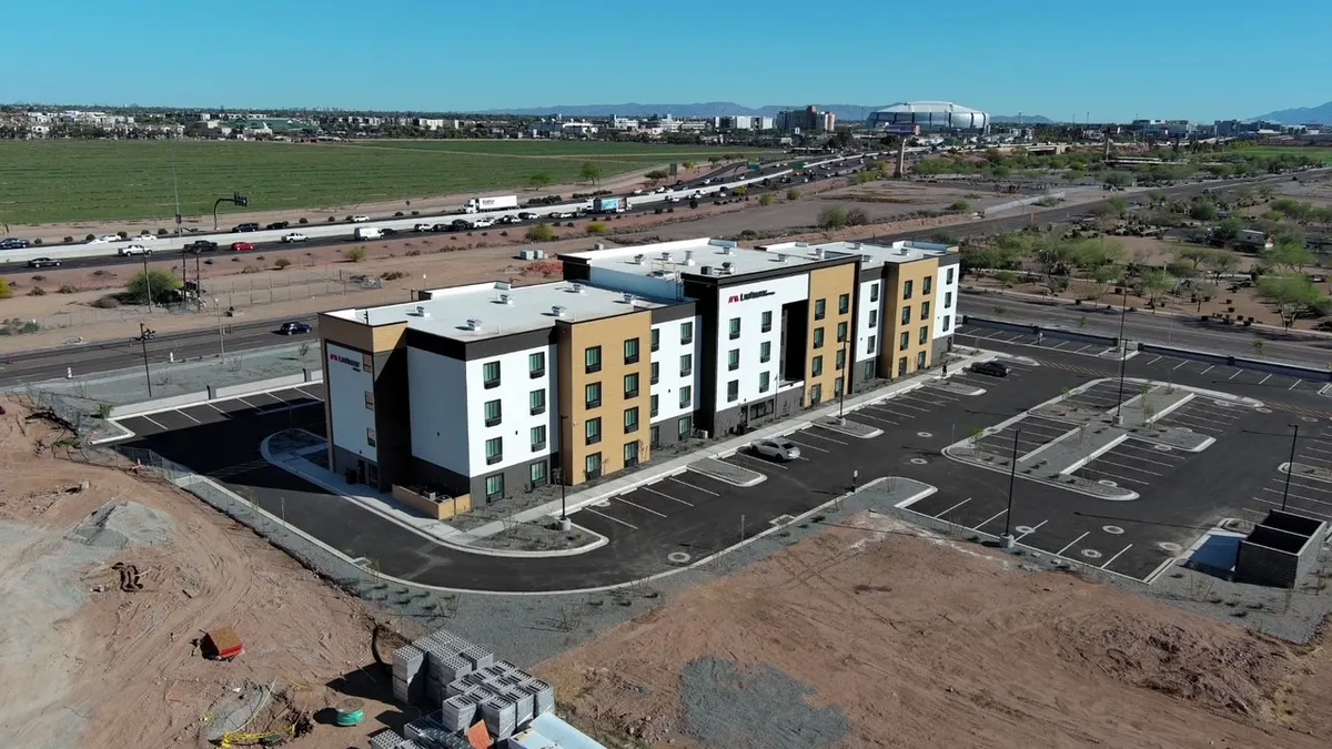 Hotel near a parking lot and highways