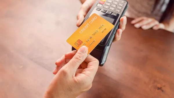 Moment of payment with a credit card through terminal.