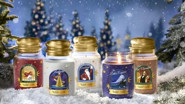 A row of candles against a snowy winter background.