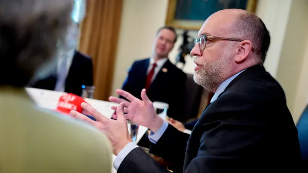 Russell Vought speaking at a cabinet meeting
